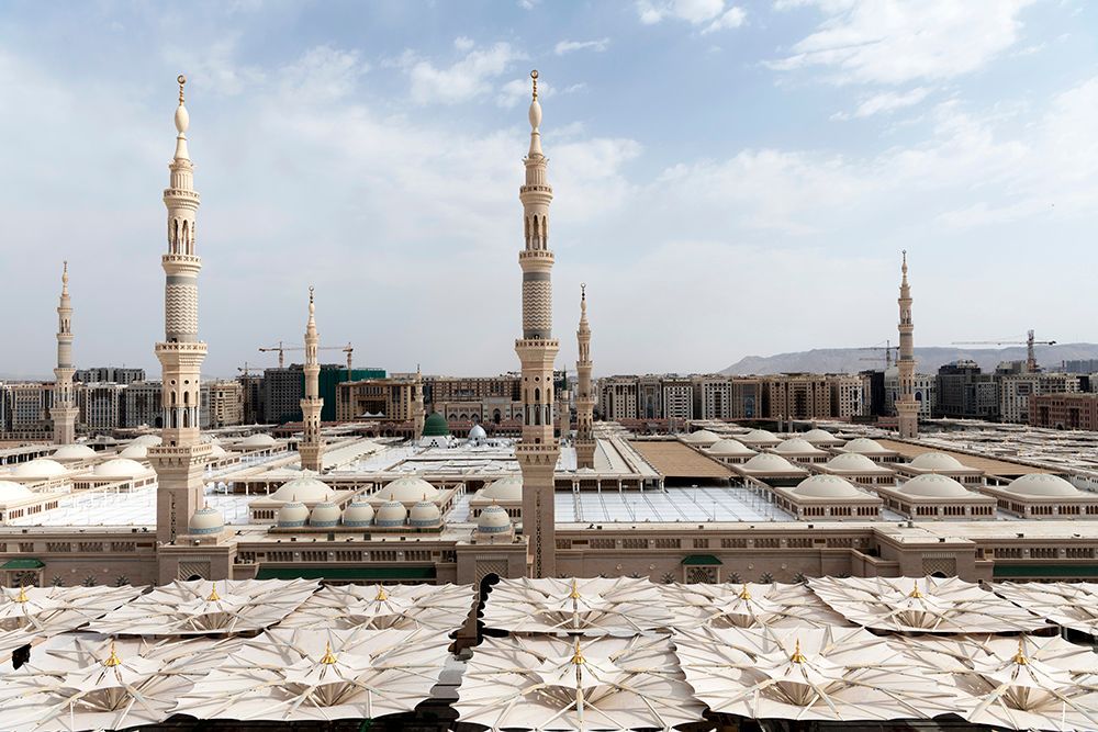 An aerieal view of the Prophet's mosque with its umbrellas, minarets and the Green Dome showing