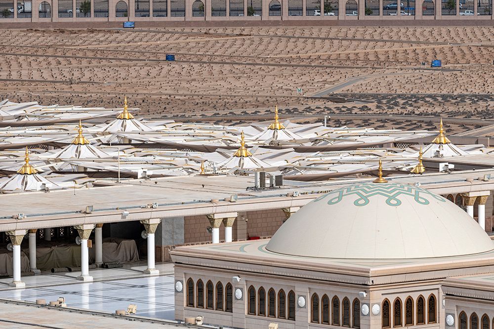 An aerieal view of the Prophet's mosque with its umbrellas, minarets and the Green Dome showing